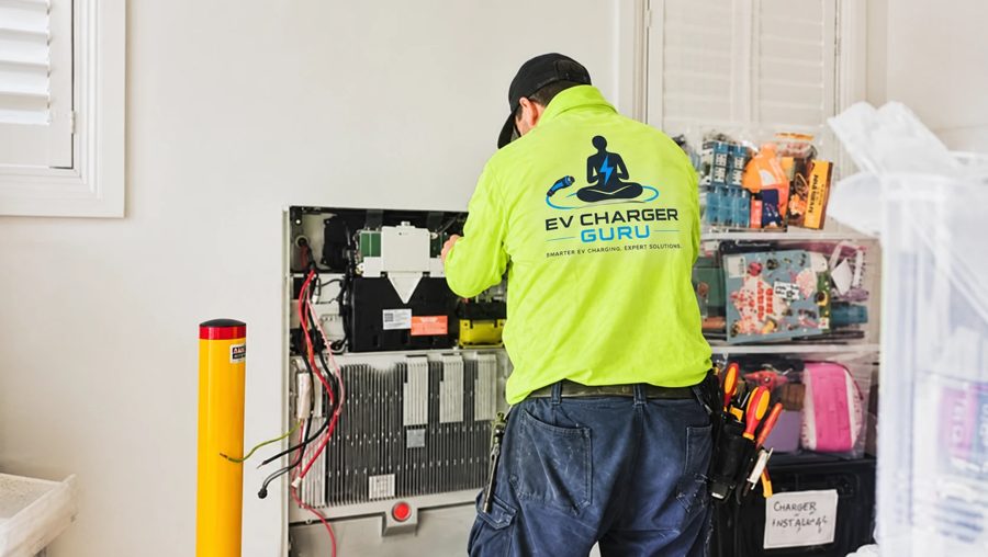 EV Charger Guru electrician working on a home electrical cabinet